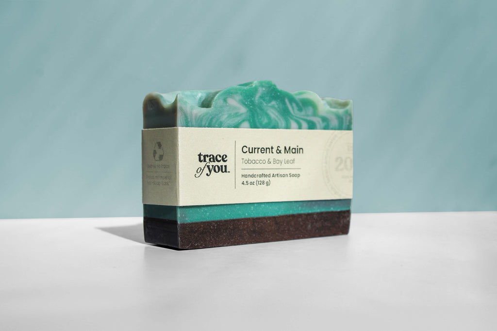 Bar of soap with a visible brand label on a light blue background