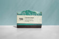 Bar of soap with a label on a light gray background