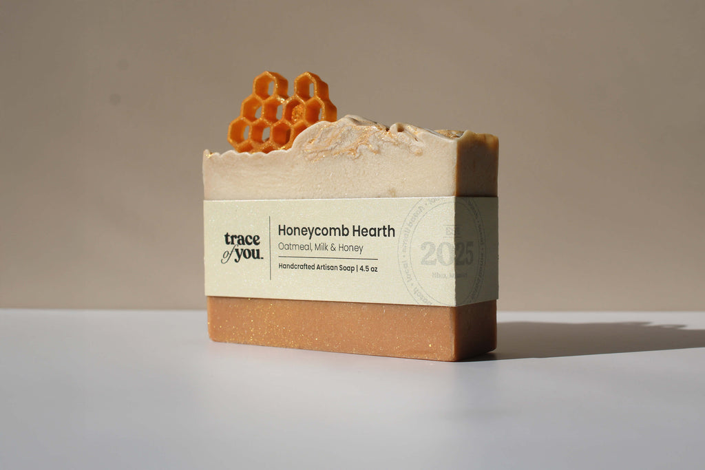 Bar of soap with packaging labeled 'Honeycomb Hearth' on a neutral background