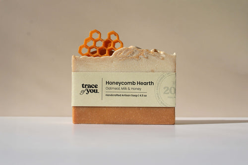 Bar of soap with honeycomb design on top and 'trace of you' branding.