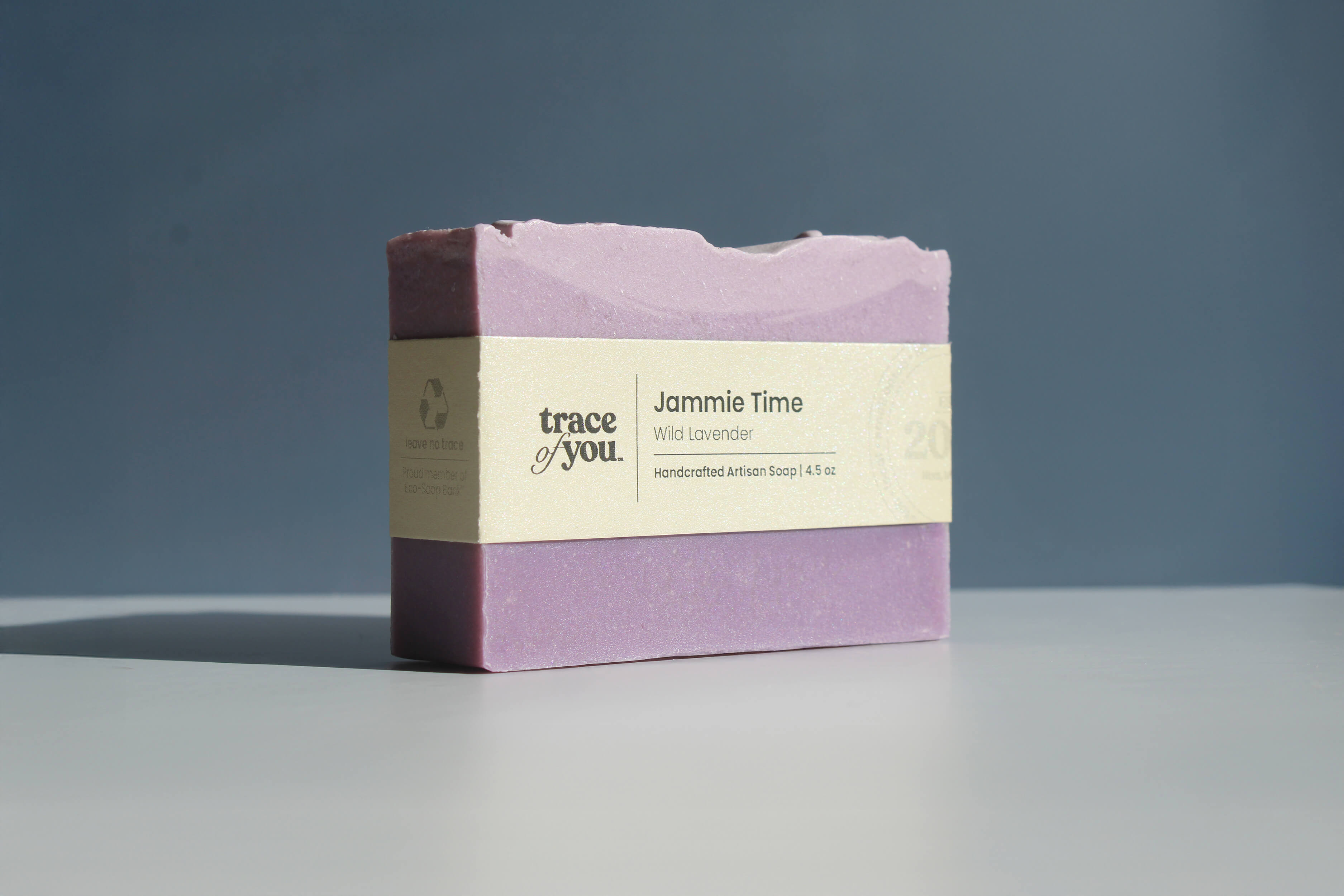 Bar of soap with a label on a gray background