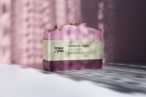 Bar of soap with 'trace of you' branding on a textured surface