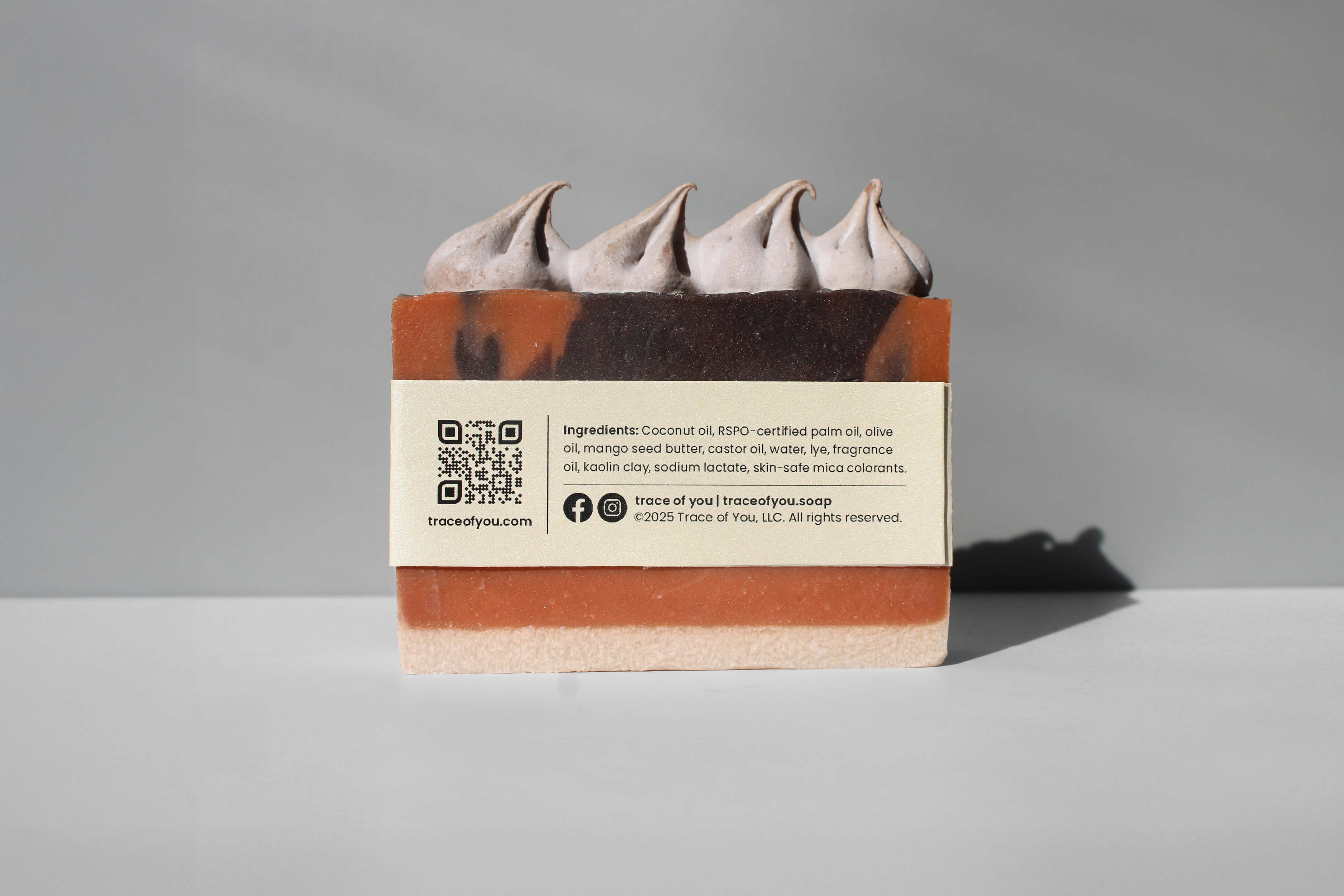 Bar of soap with a label on a gray background