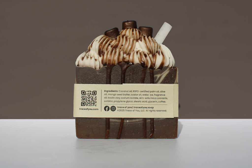 Espresso soap bar with meringue and a label on a white surface